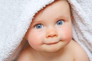 Baby in towel wants to enter the Gerber Baby Contest 